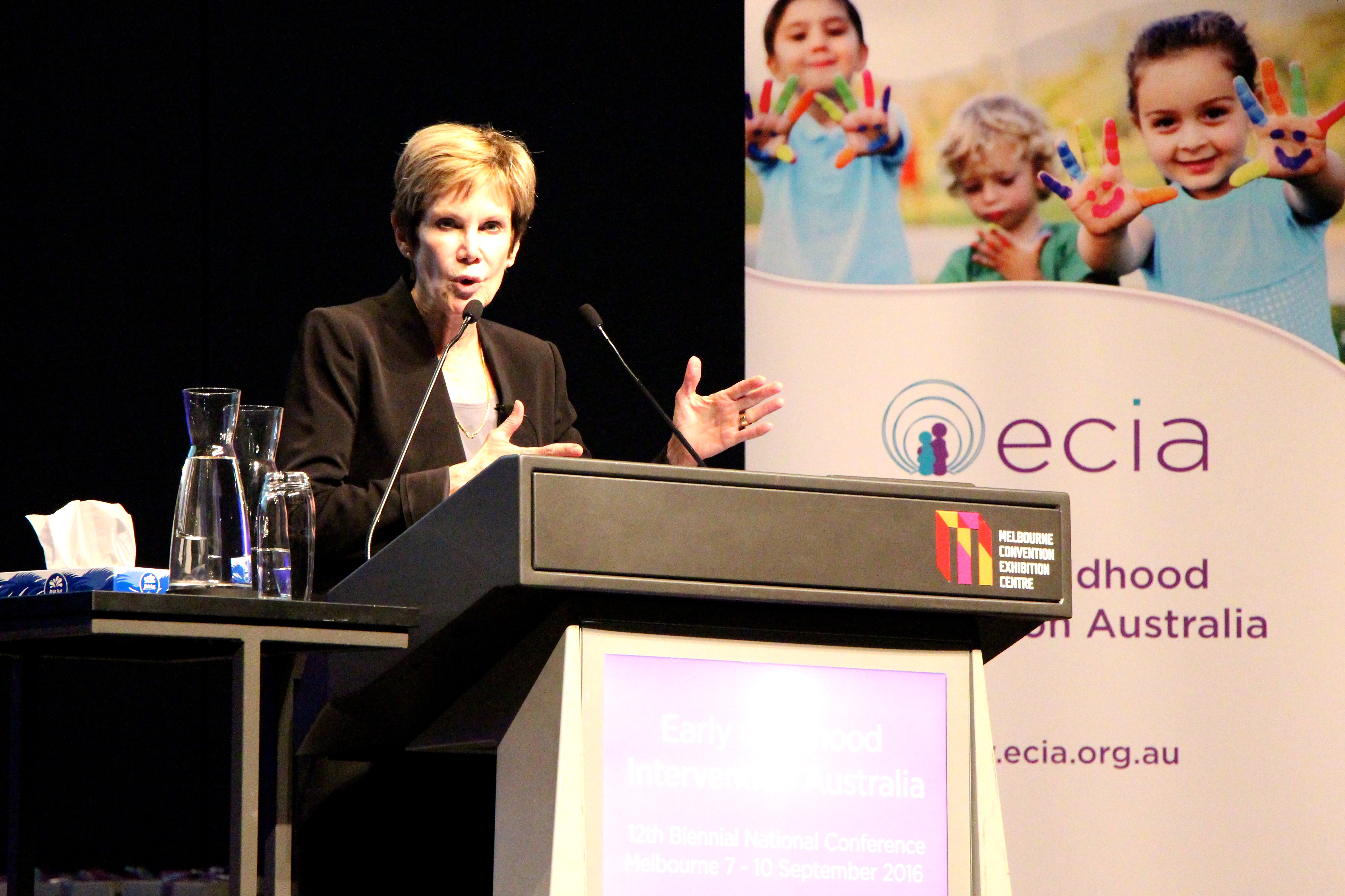 Mary McLean delivers a speech at a conference in Australia.