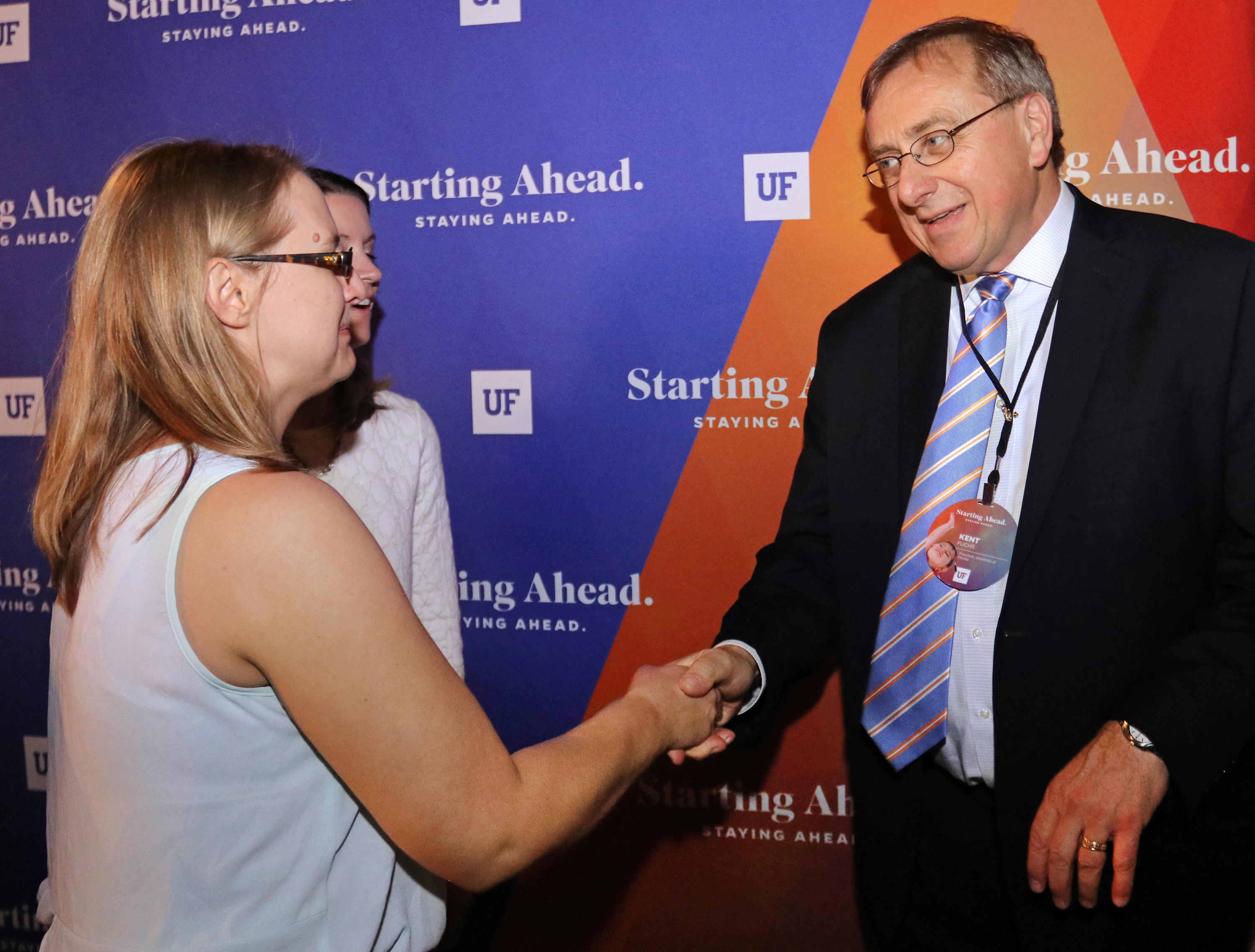 Crystal Bishop and Cinda Clark speak with UF President Dr. Fuchs