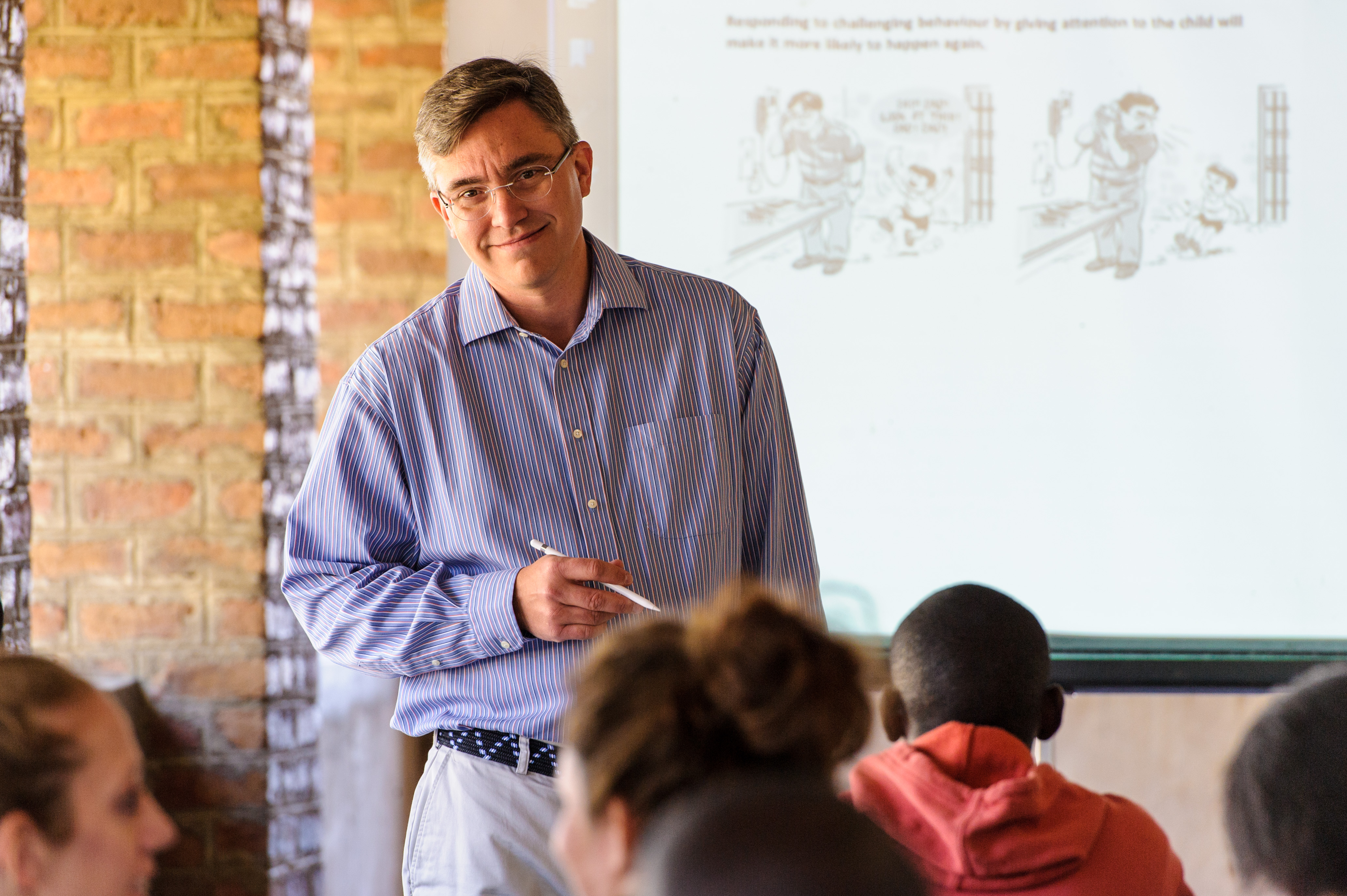 Dr. Reichow giving a presentation in Zambia