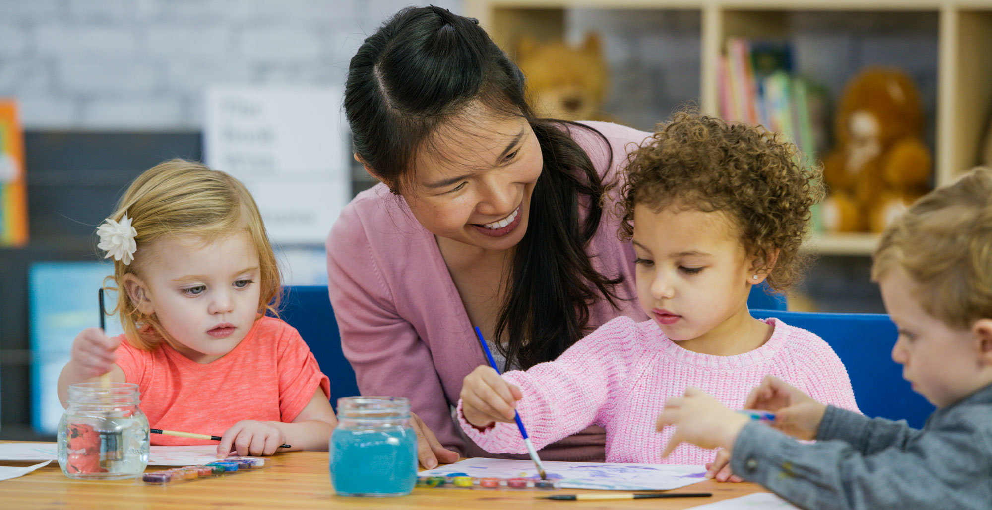 Teacher with small children