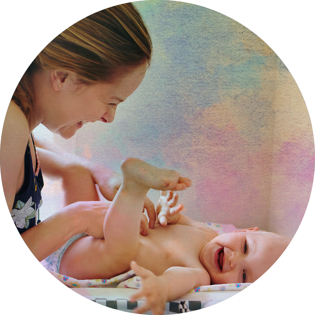 A mother changing a diaper